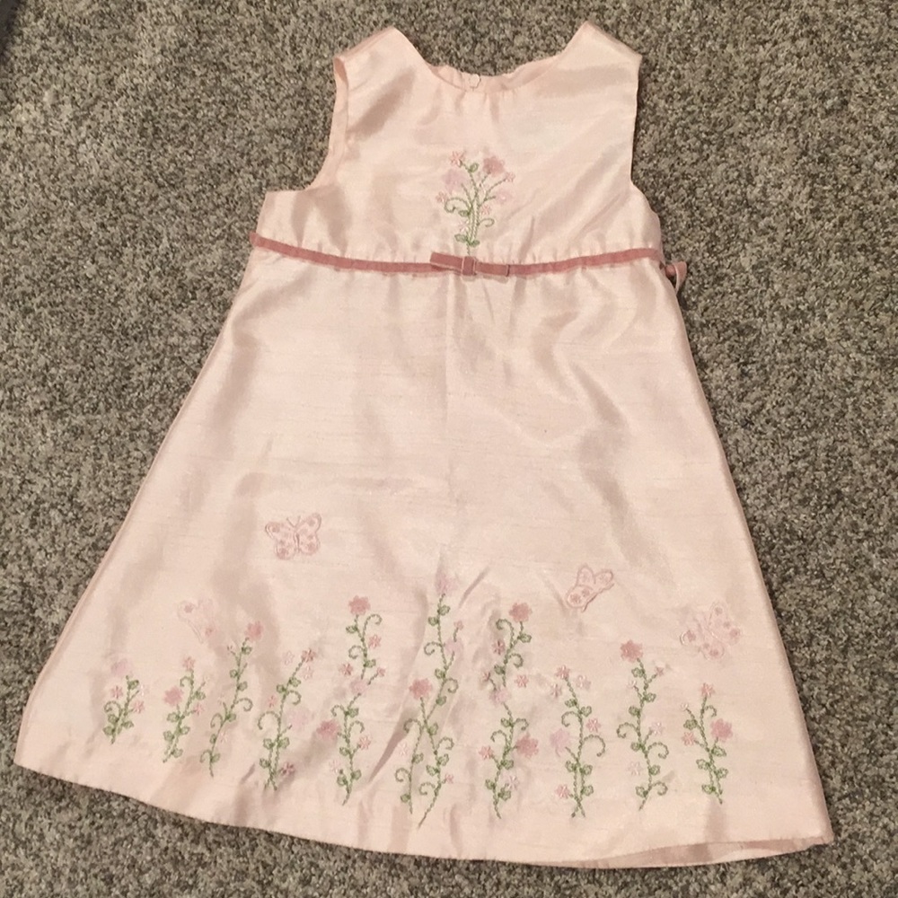 Peach dress with butterflies and flowers.